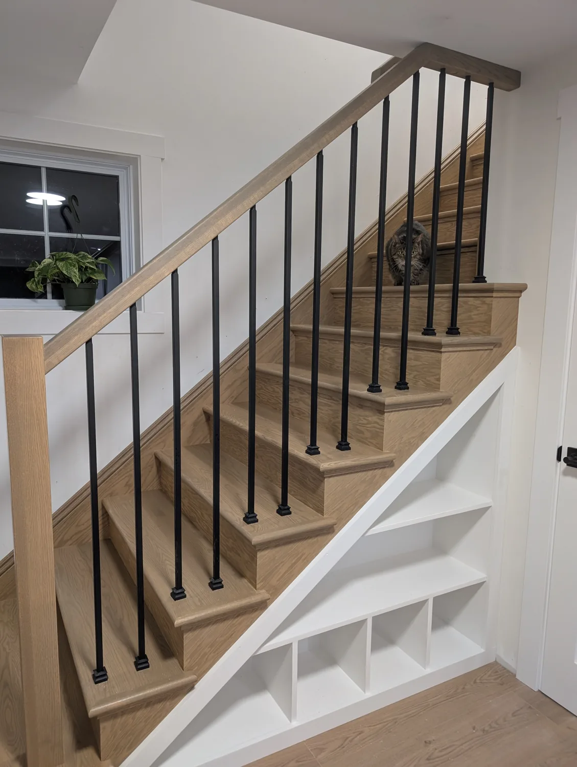 Natural oak staircase with white balusters